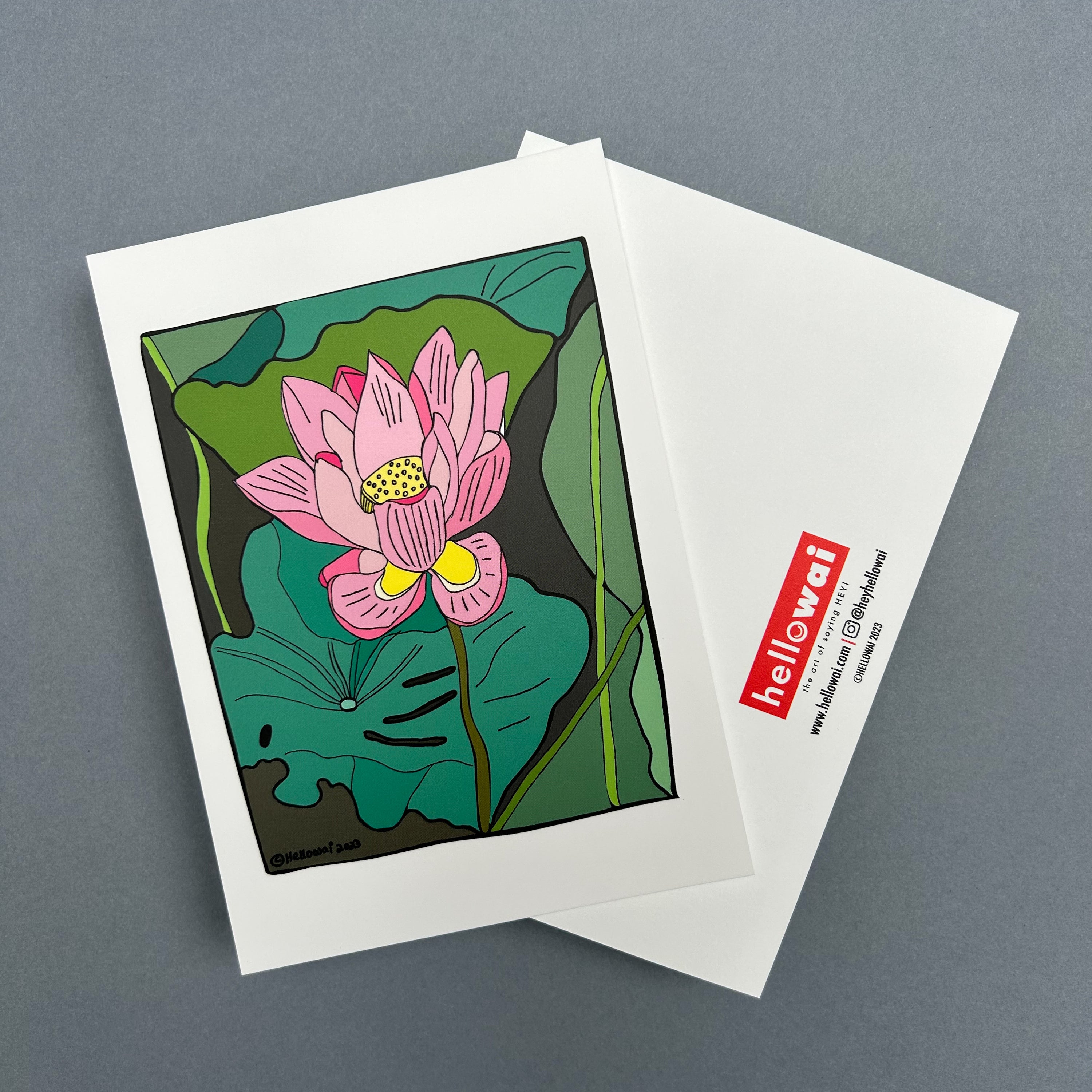 An A6 Hello Wai flat notecard. Front has colour illustration of a single lotus flower surrounded by lotus leaves in a lotus pond. Back has the Hello Wai logo.